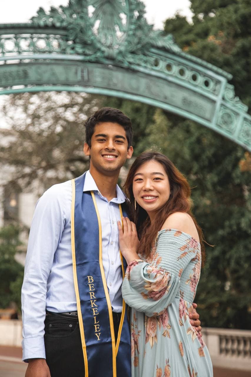 Roshan in his Berkeley stole at Sather Gate, with Amy
