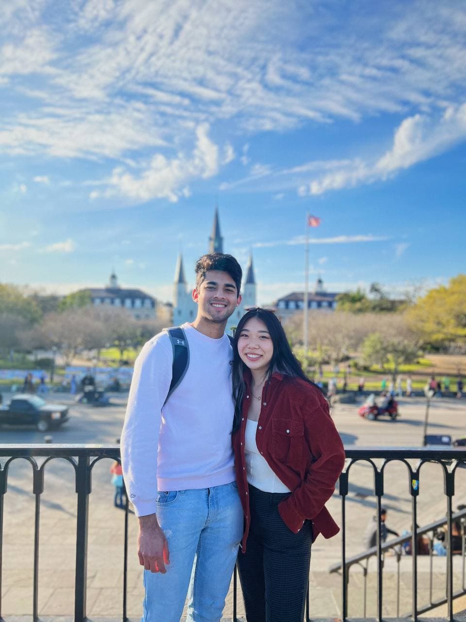 Amy and Roshan standing together in front of St. Louis Cathedral in New Orleans
